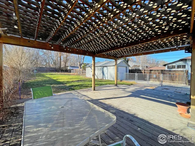 a view of a backyard with swimming pool
