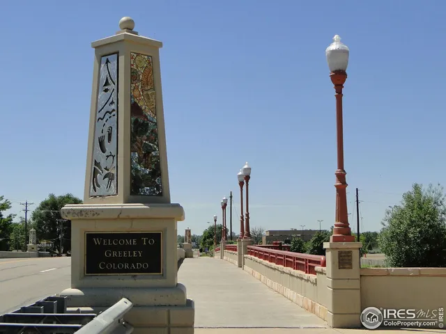 a front view of a building with parking area