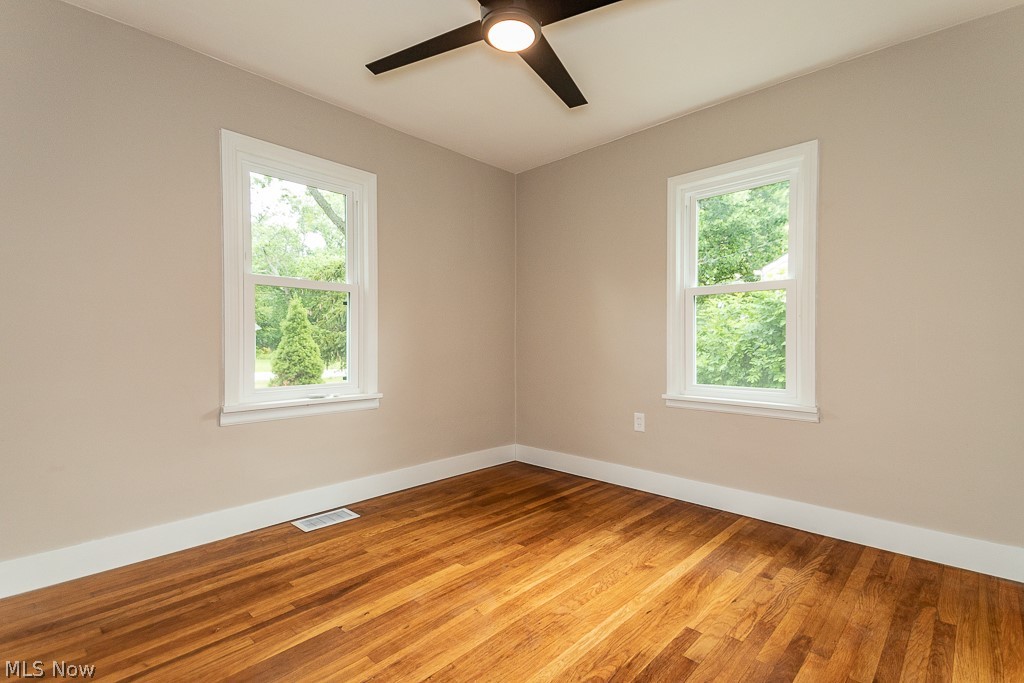 8360 Edgewood Road Mentor, OH 44060 - Photo 12 of 30 Bedroom with two windows and a new ceiling fan.