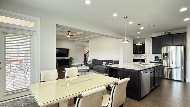 a en suite bathroom with a double vanity sink and a mirror