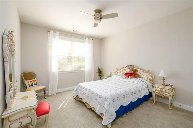 a white toilet sitting next to a bathroom sink