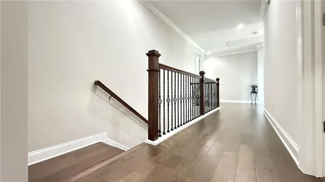 a spacious bedroom with a bed and a chandelier