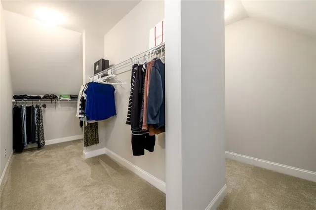 a bedroom with a bed and cabinets