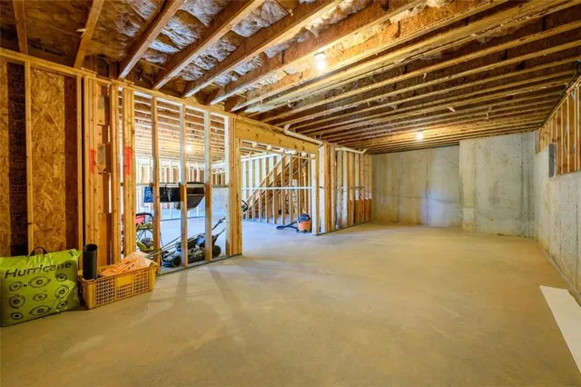 a view of a porch with wooden floor and outdoor seating