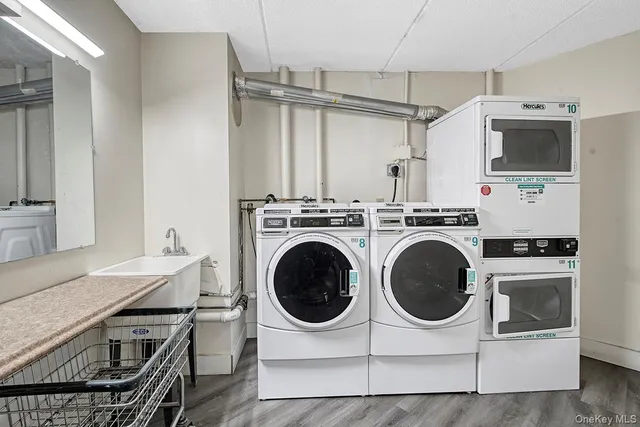 a kitchen with a sink a washer and dryer