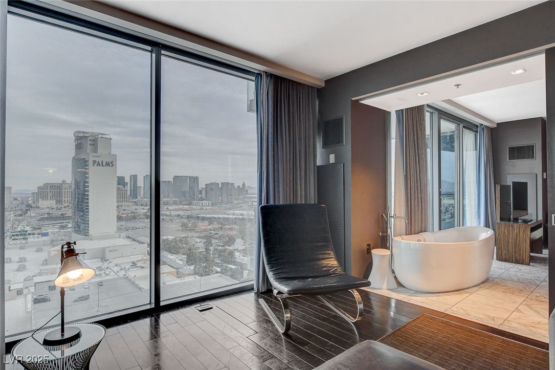 4381 West Flamingo Road, Unit 2202 Las Vegas, NV 89103 - Photo 11 of 40 Sitting room featuring wood finished floors