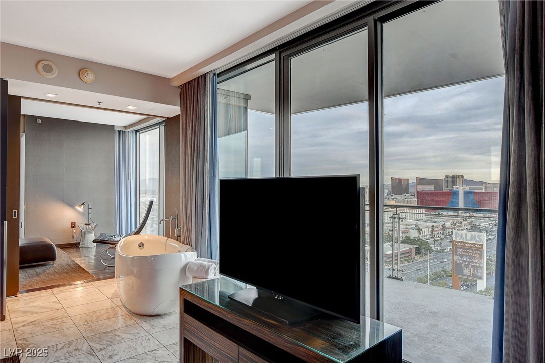 4381 West Flamingo Road, Unit 2202 Las Vegas, NV 89103 - Photo 21 of 40 Living room featuring light marble finish flooring