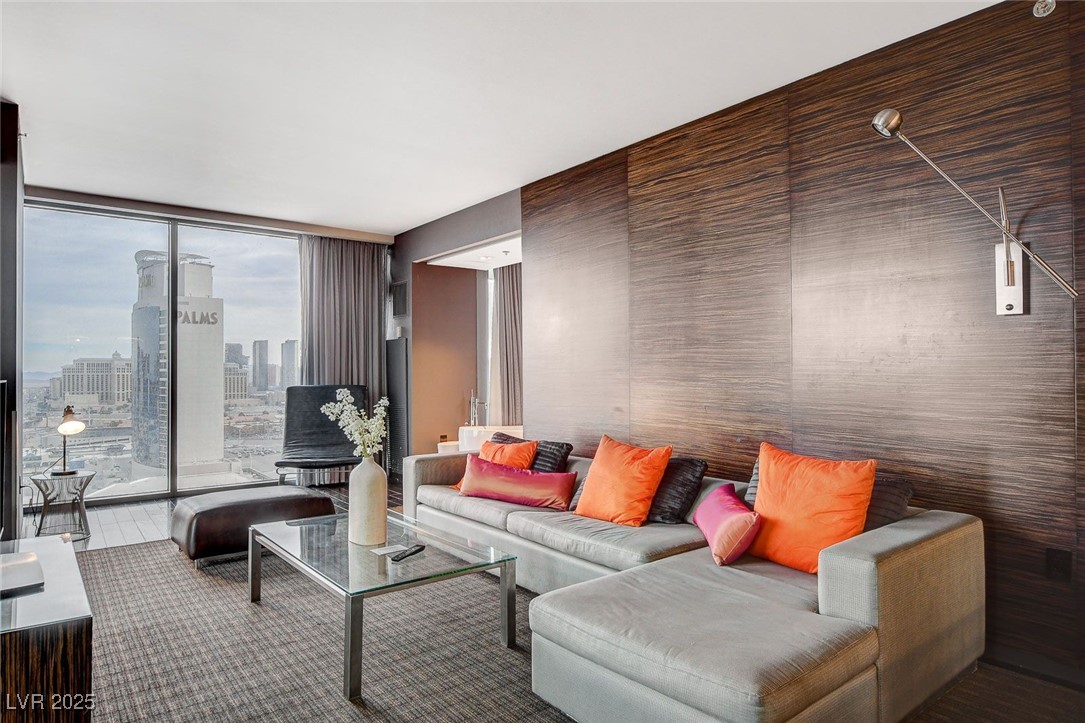 4381 West Flamingo Road, Unit 2202 Las Vegas, NV 89103 - Photo 4 of 40 Living area featuring floor to ceiling windows