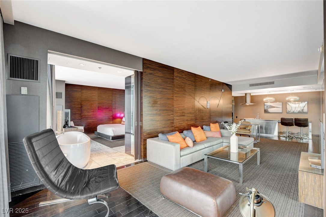 4381 West Flamingo Road, Unit 2202 Las Vegas, NV 89103 - Photo 7 of 40 Living area featuring wood finished floors