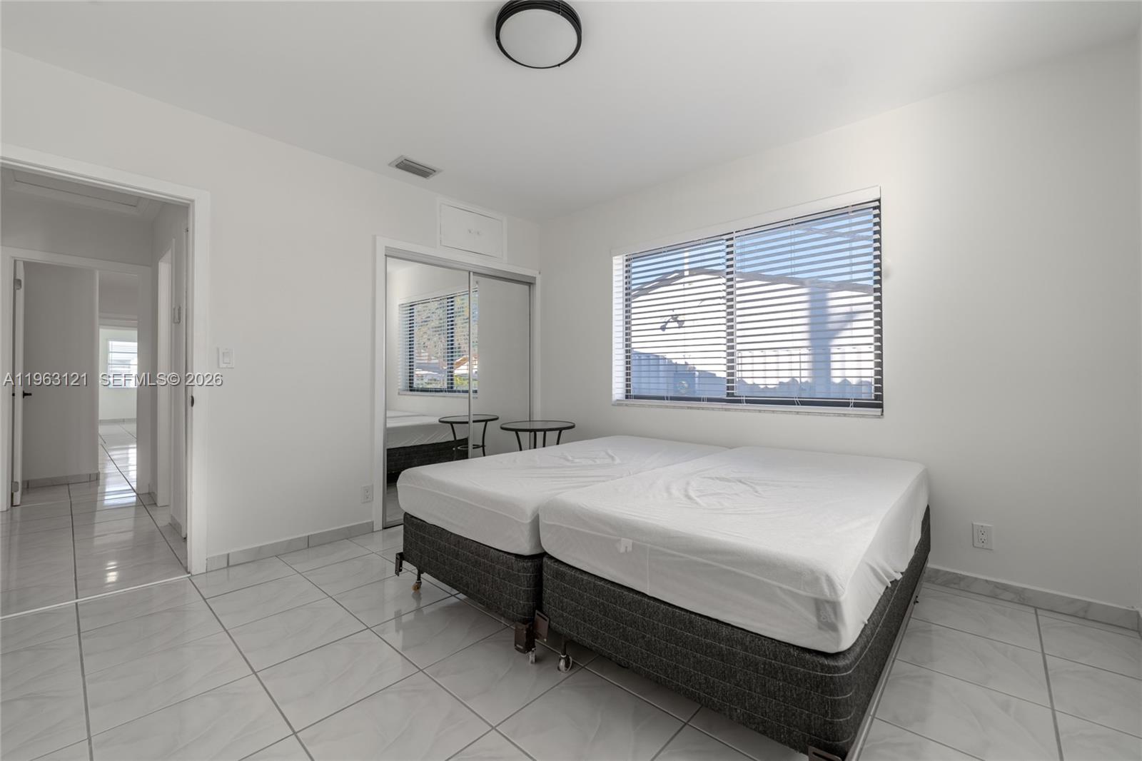 1631 Southwest 21st Street Miami, FL 33145 - Photo 13 of 58 a bedroom with a bed and window