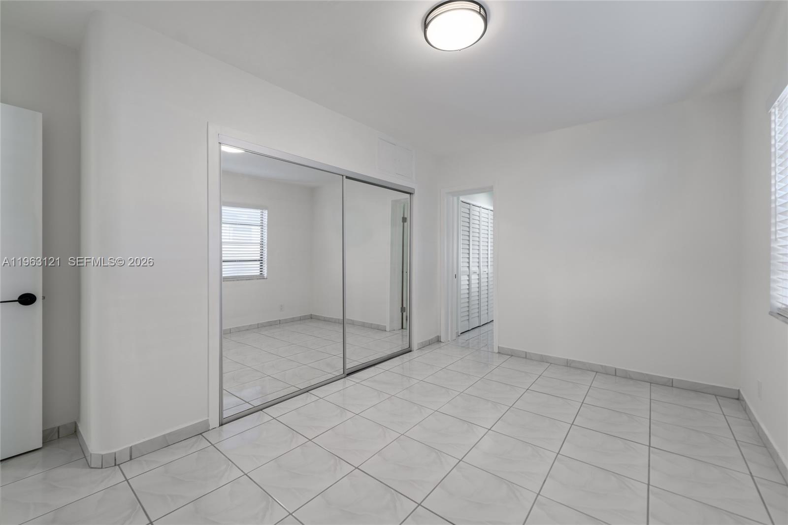 1631 Southwest 21st Street Miami, FL 33145 - Photo 16 of 58 a view of an empty room with window
