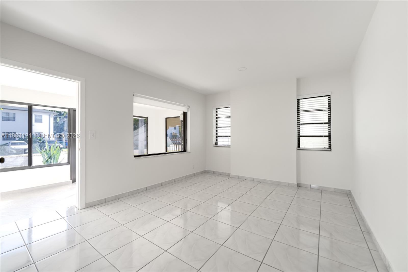 1631 Southwest 21st Street Miami, FL 33145 - Photo 20 of 58 an empty room with windows