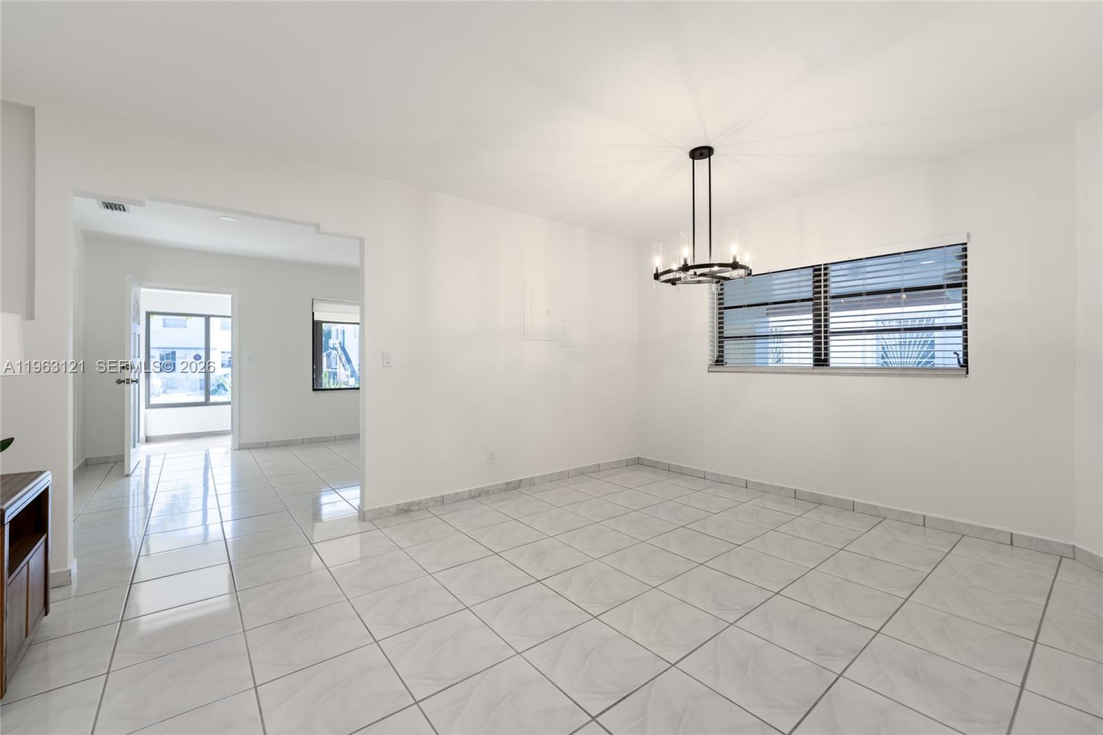 1631 Southwest 21st Street Miami, FL 33145 - Photo 22 of 58 an empty room with windows and fan