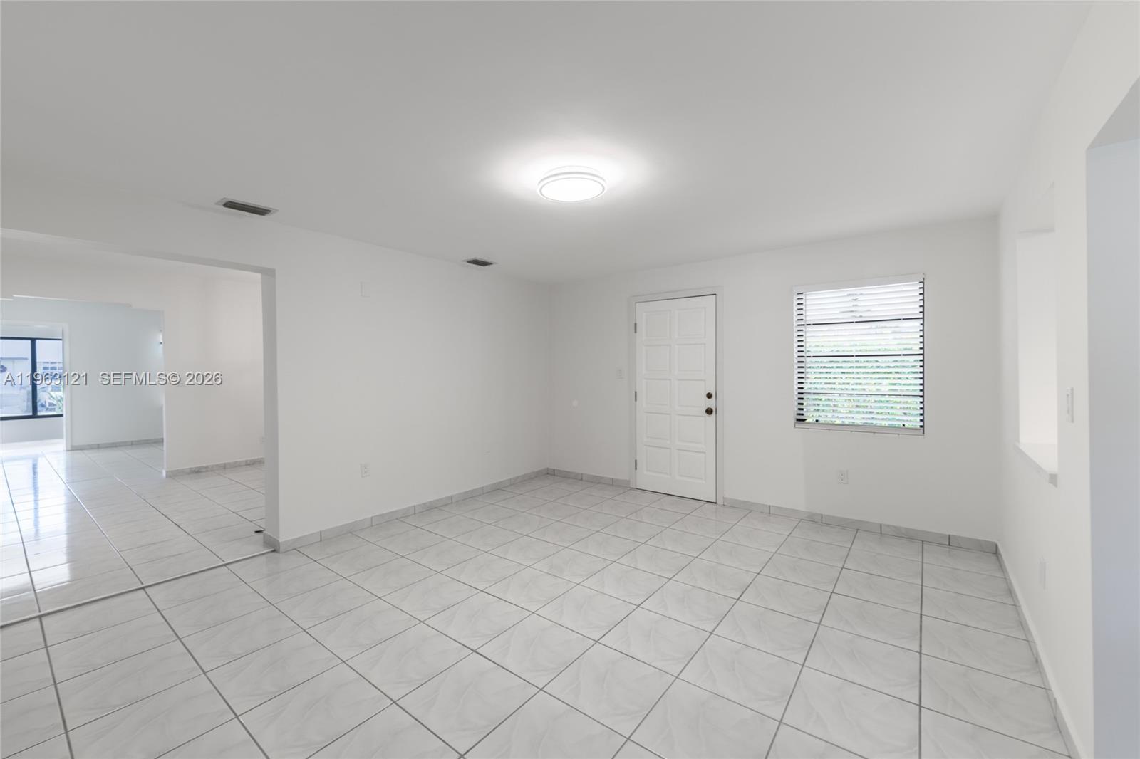 1631 Southwest 21st Street Miami, FL 33145 - Photo 28 of 58 an empty room with white walls and windows