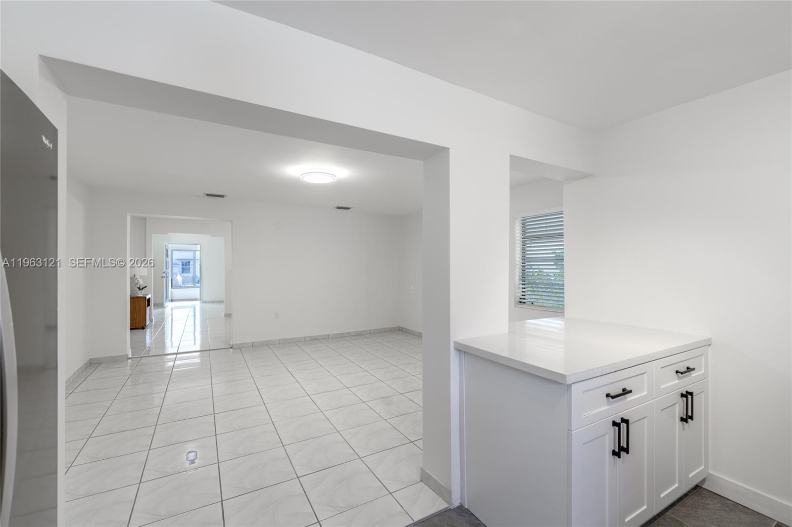 1631 Southwest 21st Street Miami, FL 33145 - Photo 29 of 58 a view of a kitchen with white cabinets