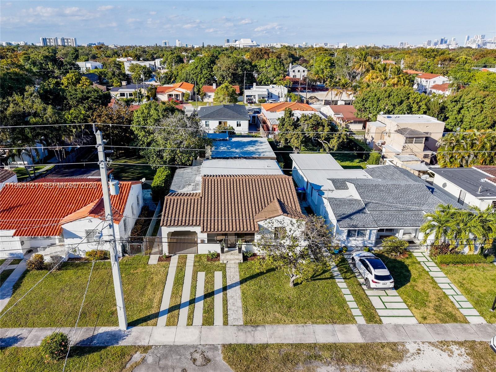 1631 Southwest 21st Street Miami, FL 33145 - Photo 3 of 58 an aerial view of a house with swimming pool and ocean view
