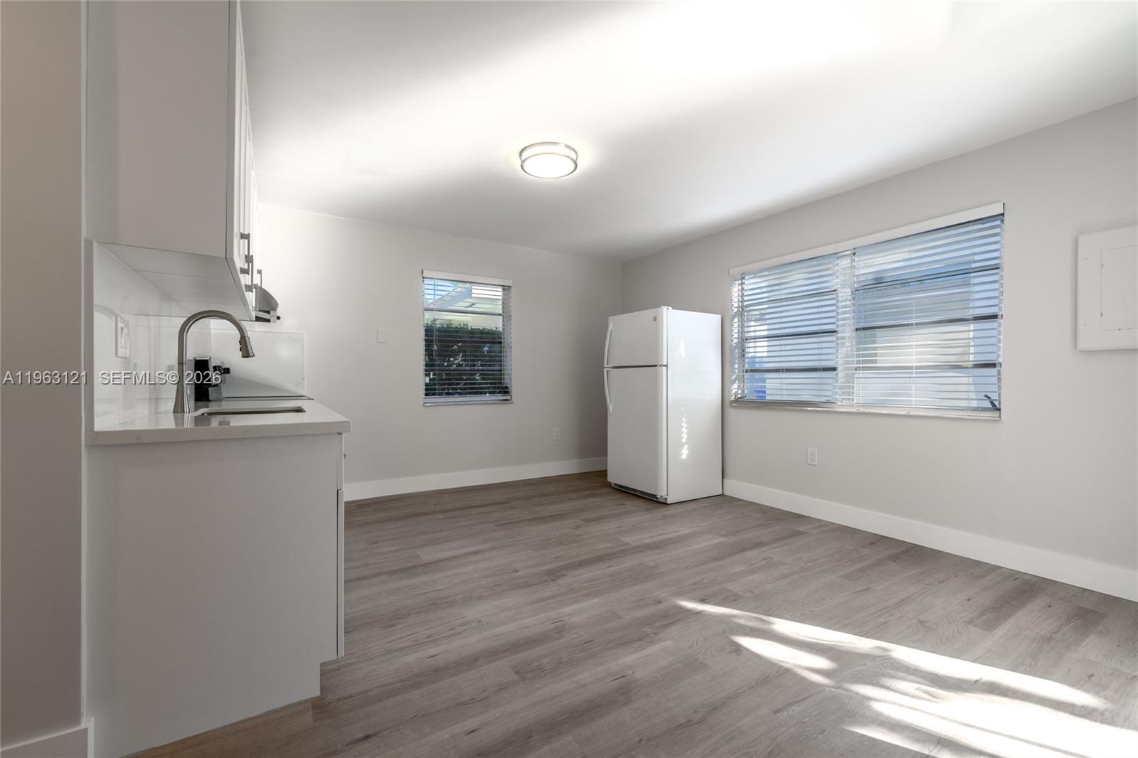 1631 Southwest 21st Street Miami, FL 33145 - Photo 32 of 58 a view of kitchen and empty room with windows