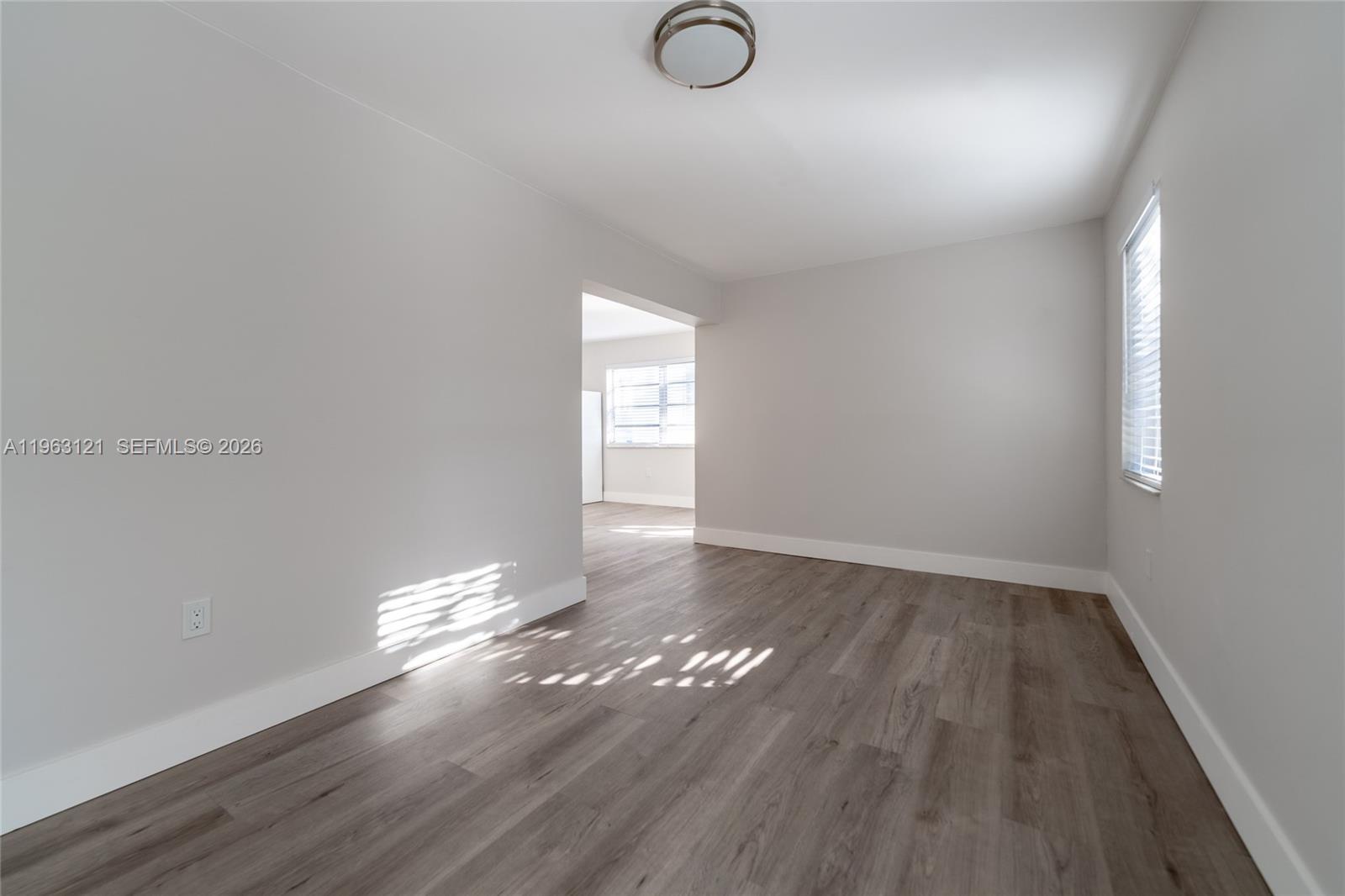 1631 Southwest 21st Street Miami, FL 33145 - Photo 33 of 58 a view of empty room with wooden floor and fan