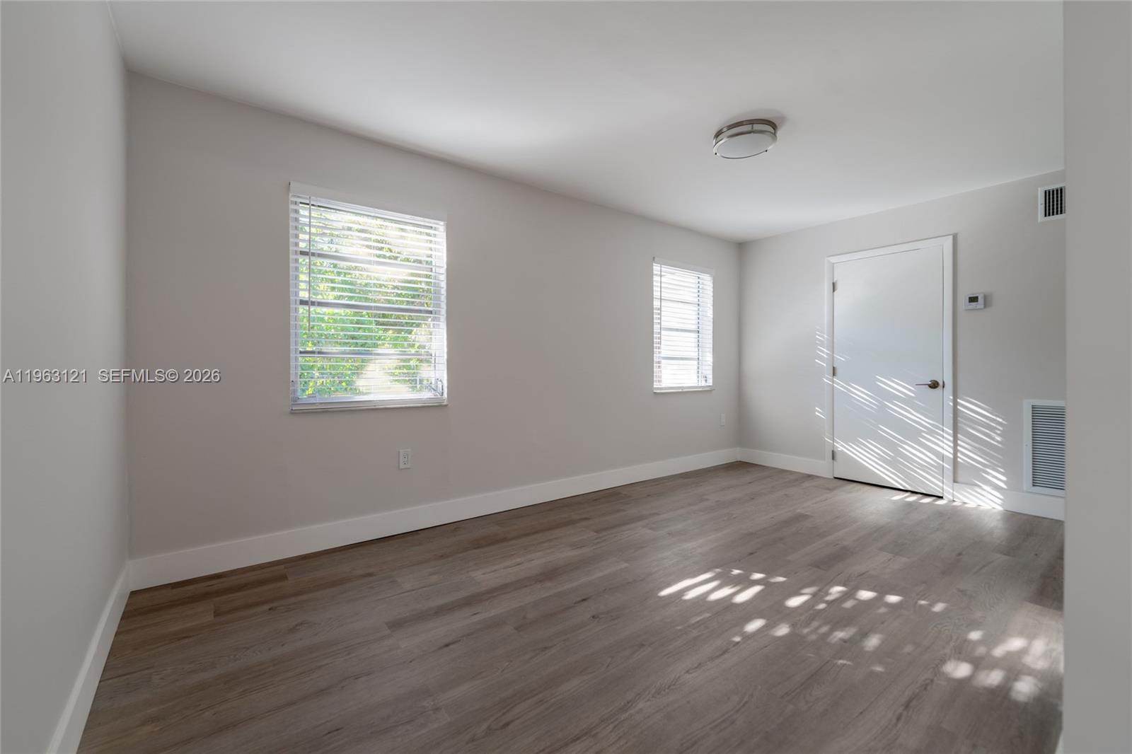 1631 Southwest 21st Street Miami, FL 33145 - Photo 34 of 58 a view of wooden floor and windows in a room