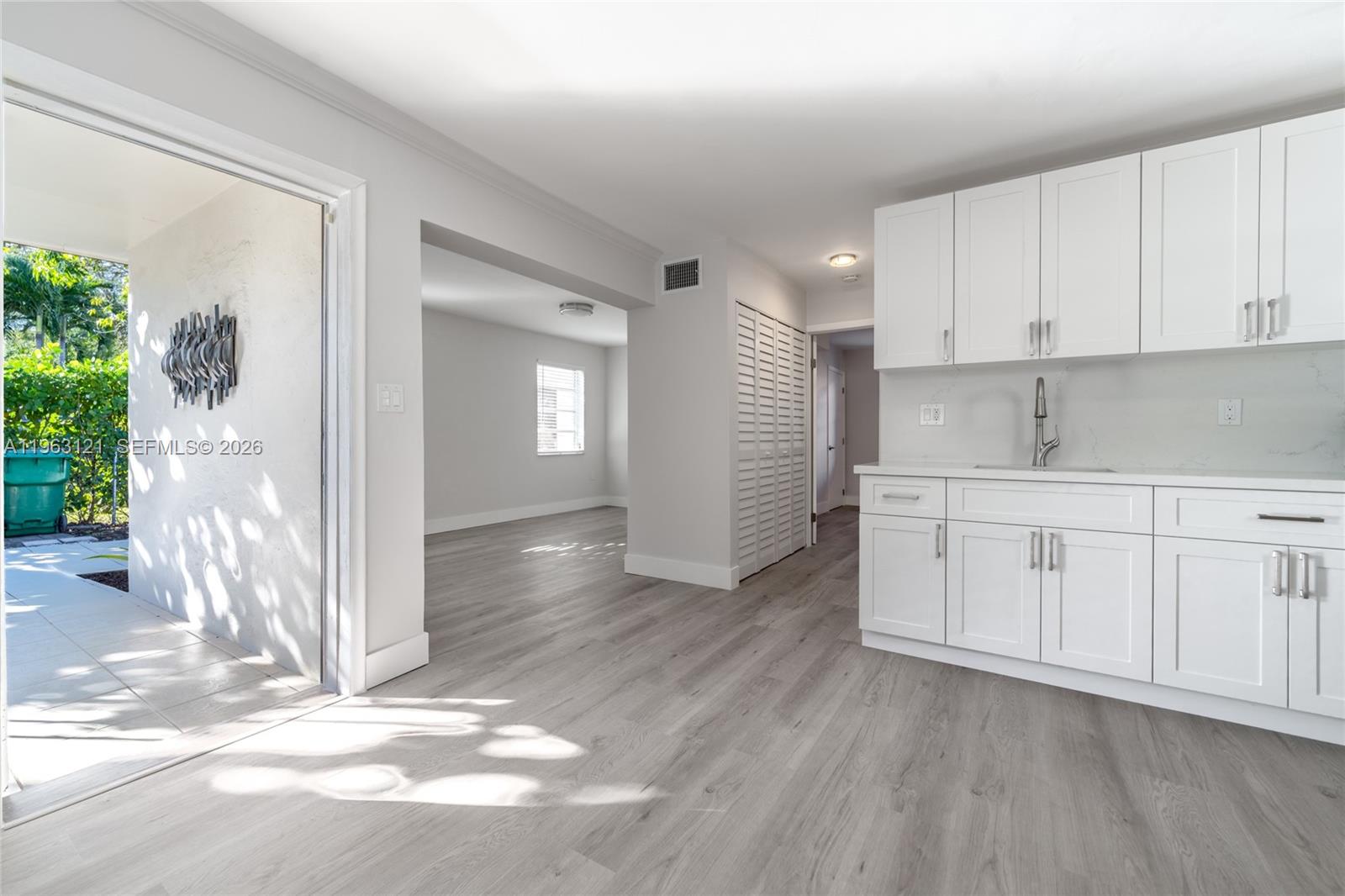 1631 Southwest 21st Street Miami, FL 33145 - Photo 36 of 58 a view of a kitchen with wooden floor and electronic appliances