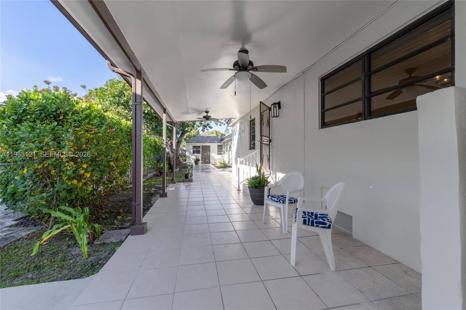 1631 Southwest 21st Street Miami, FL 33145 - Photo 41 of 58 a lobby with furniture and potted plants