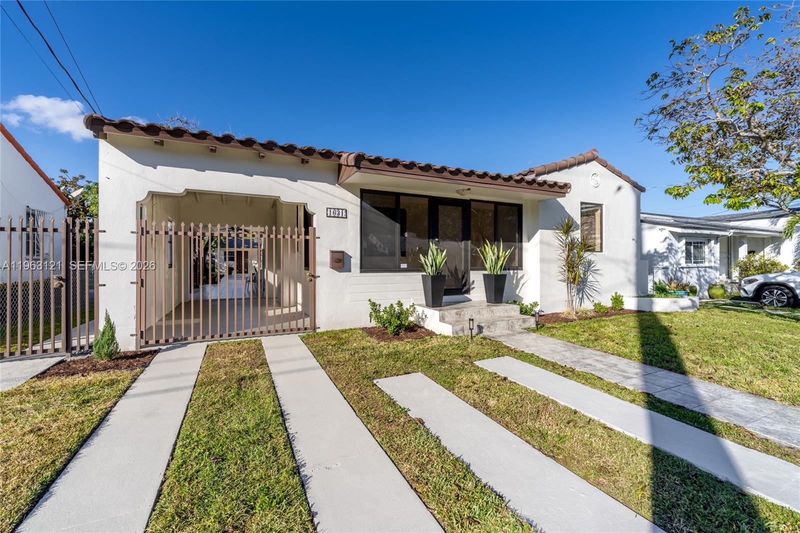 1631 Southwest 21st Street Miami, FL 33145 - Photo 47 of 58 a front view of a house with a porch