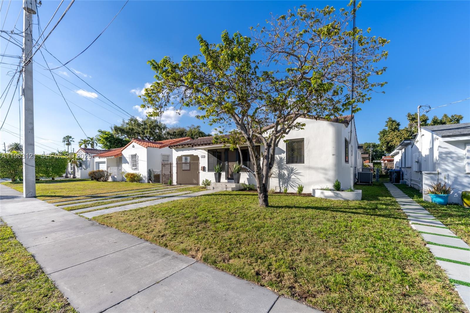 1631 Southwest 21st Street Miami, FL 33145 - Photo 48 of 58 a front view of a house with a yard