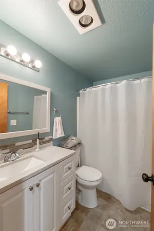a bedroom with a bed and a table in it