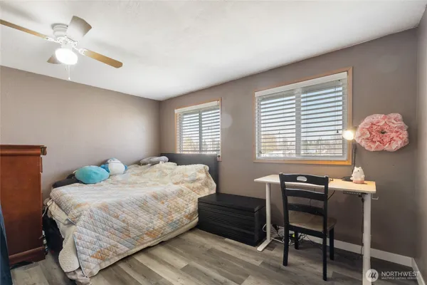 a bedroom with a bed and window