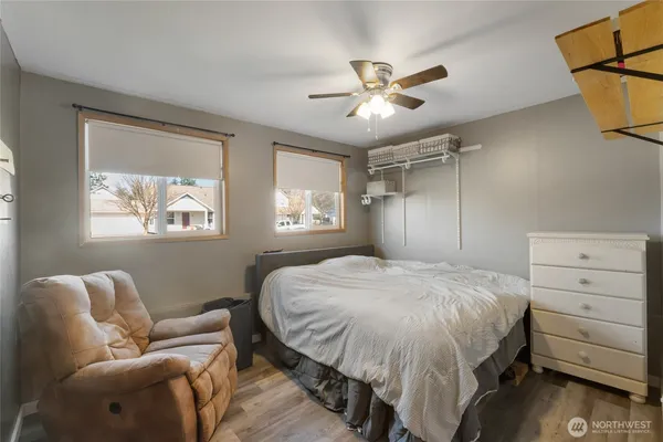 a bedroom with furniture and a window