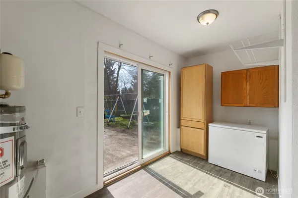 a utility room with a window dryer and washer