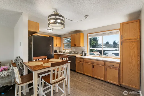 a kitchen with stainless steel appliances a stove sink and cabinets