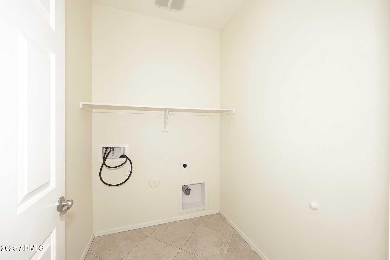 11020 East Shepperd Avenue Mesa, AZ 85212 - Photo 16 of 37 a view of a room with rack on the wall