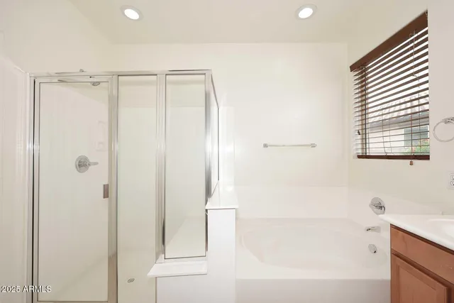 a bathroom with a shower and a sink