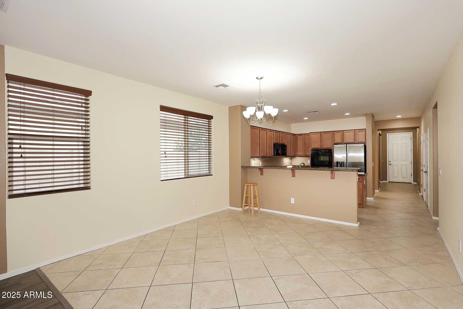 11020 East Shepperd Avenue Mesa, AZ 85212 - Photo 9 of 37 a view of a kitchen with furniture and a window