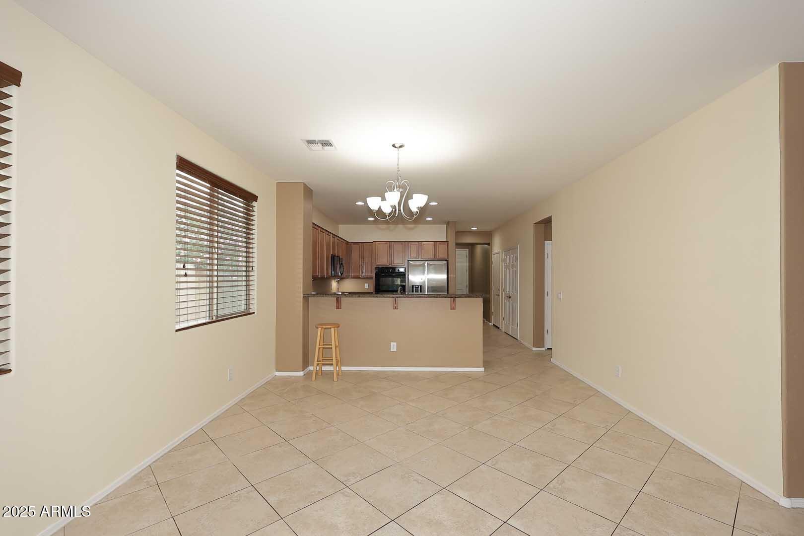 11020 East Shepperd Avenue Mesa, AZ 85212 - Photo 10 of 37 a view of a kitchen with a sink cabinets and a window
