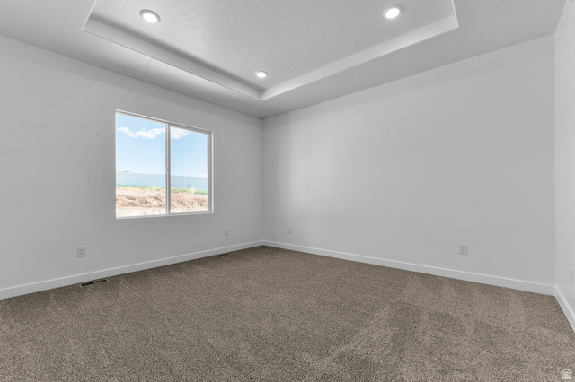 1338 West 2350 South, Unit 19 Perry, UT 84302 - Photo 13 of 14 Spacious room with tray ceiling and recessed lighting
