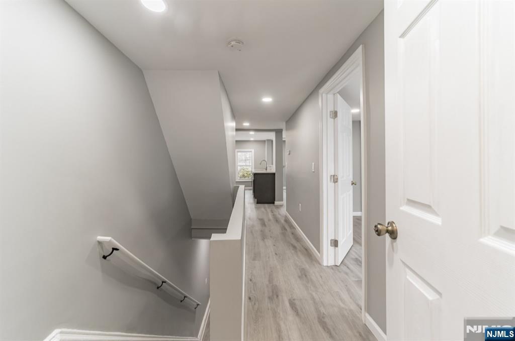 15 South Prospect Street, Unit B Verona, NJ 07044 - Photo 11 of 15 a view of a hallway with wooden floor and staircase