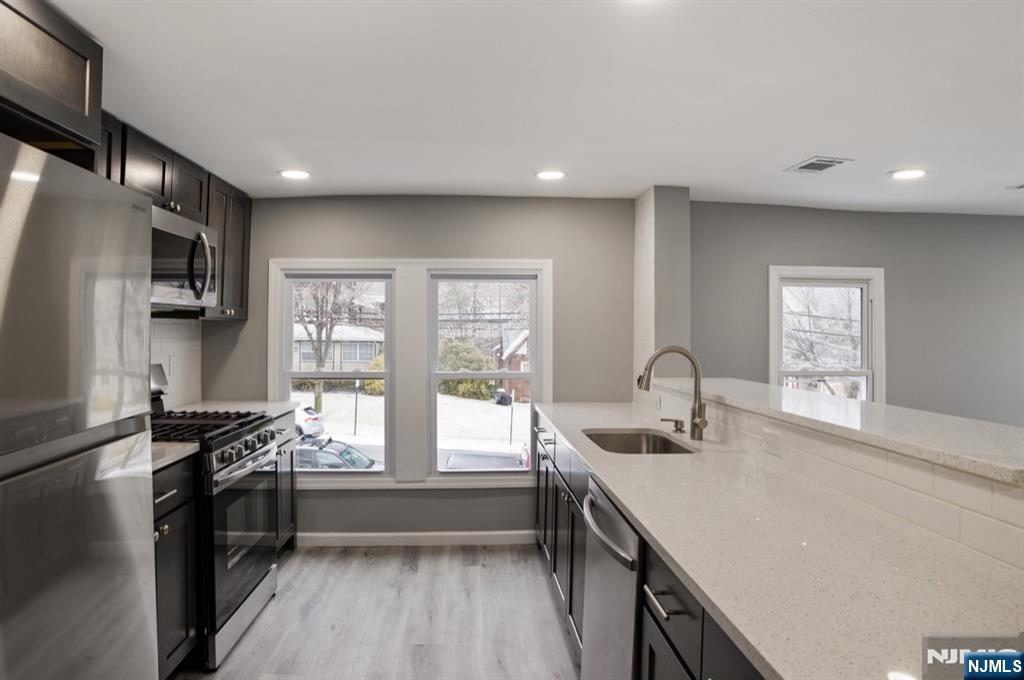 15 South Prospect Street, Unit B Verona, NJ 07044 - Photo 3 of 15 a kitchen with a sink appliances and cabinets