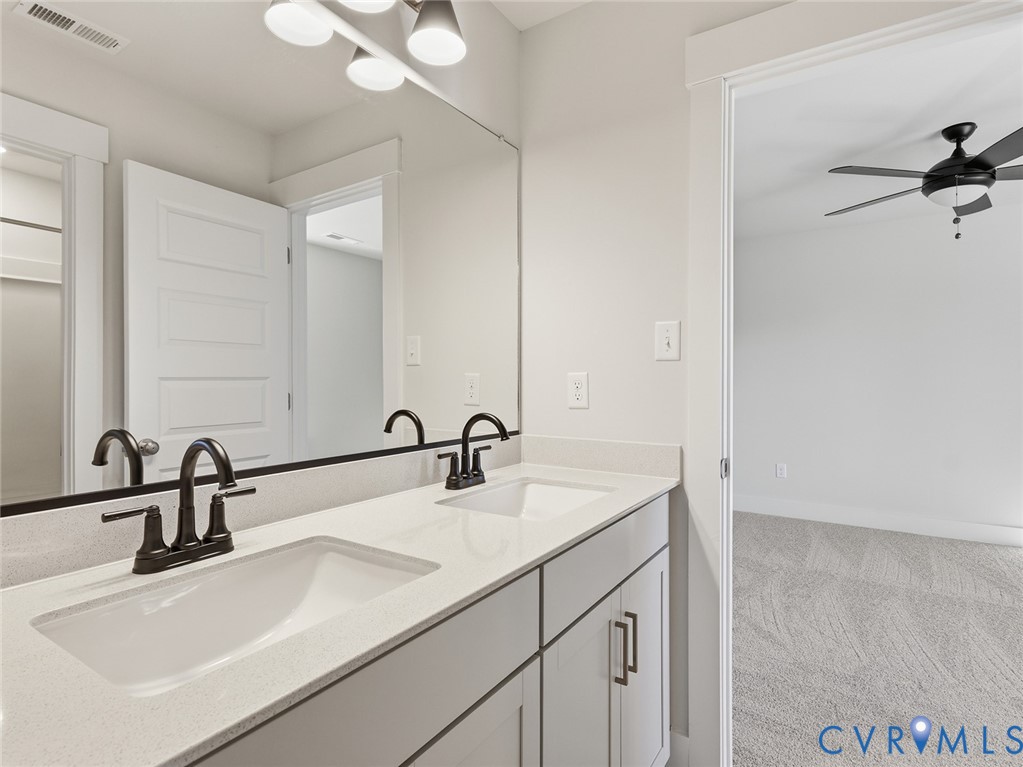 1711 Reed Marsh Lane Goochland, VA 23063 - Photo 21 of 25 a bathroom with a sink and a mirror