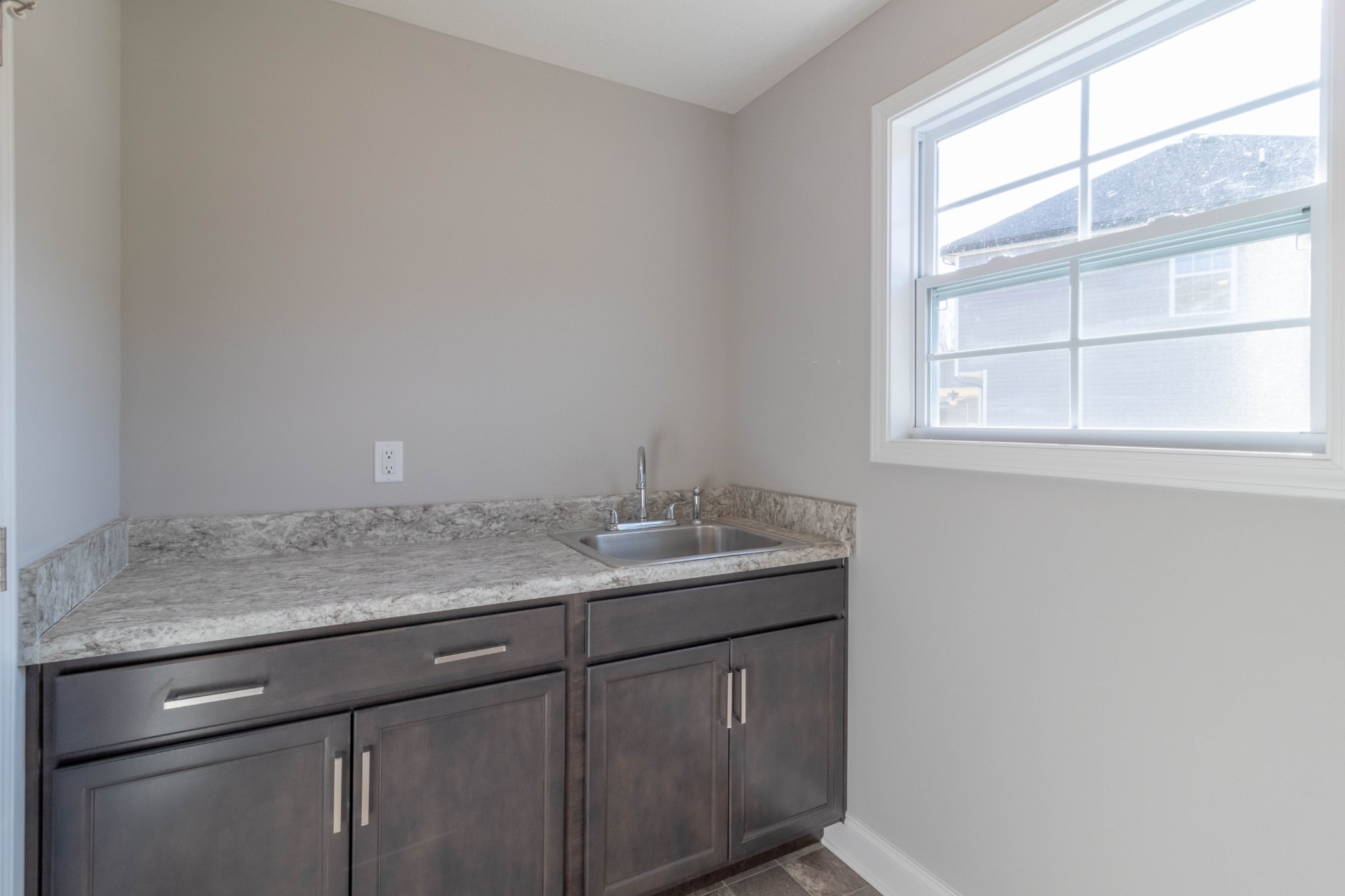 1688 Rains Road Clarksville, TN 37042 - Photo 13 of 32 a bathroom with a granite countertop sink and window