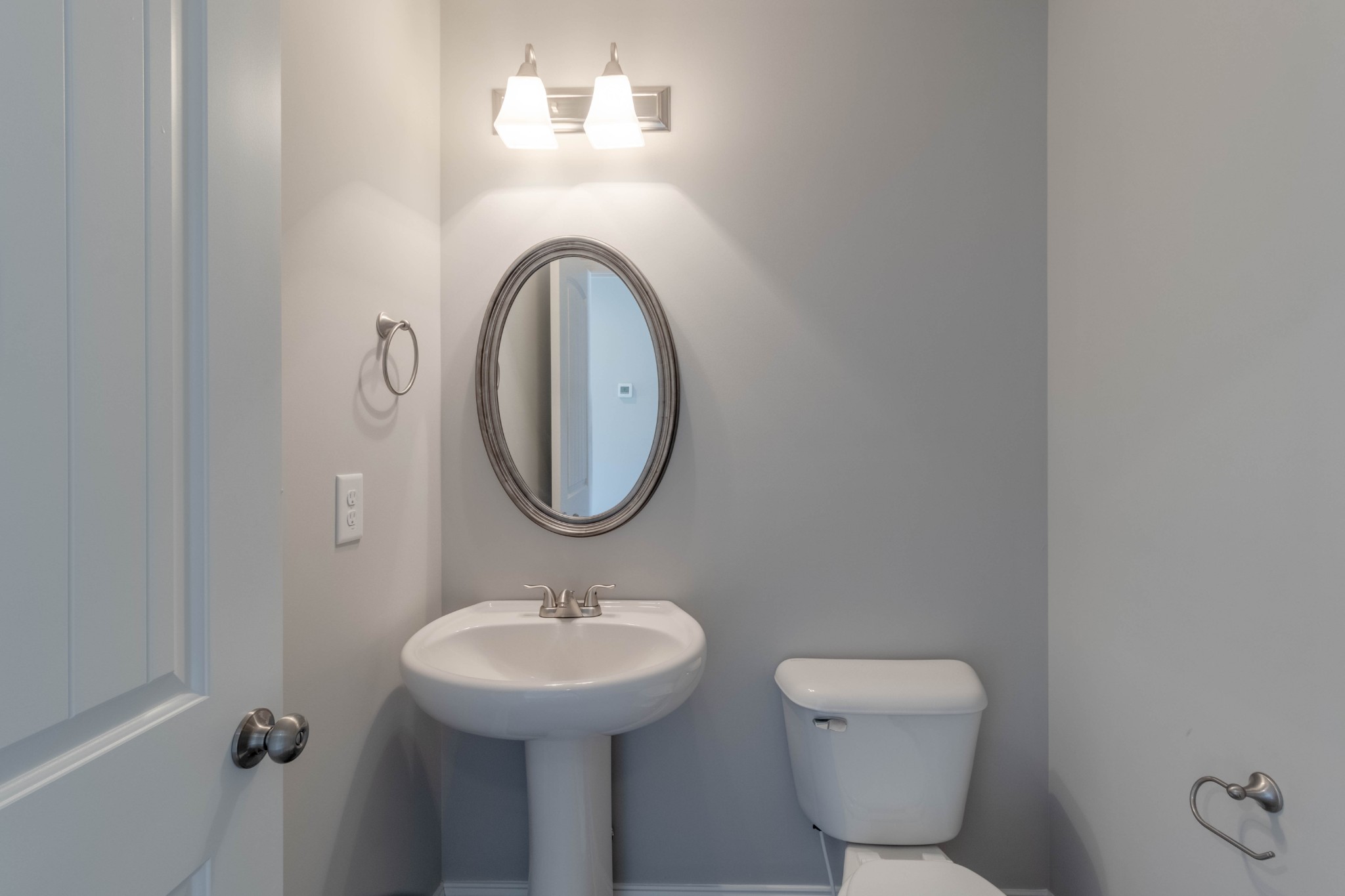 1688 Rains Road Clarksville, TN 37042 - Photo 14 of 32 a bathroom with a sink and a mirror