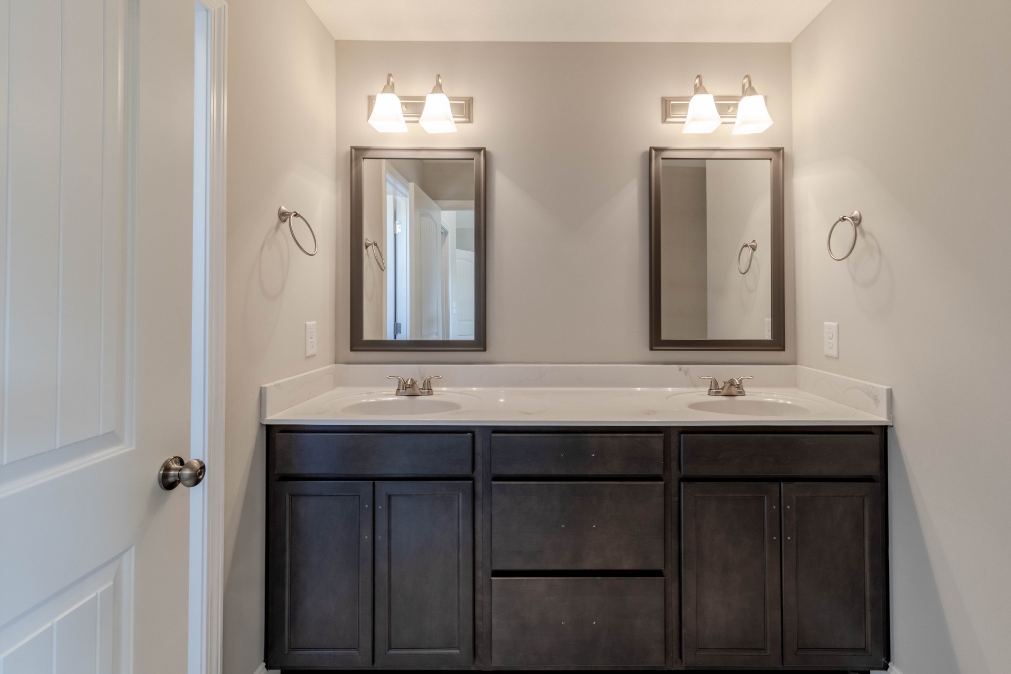 1688 Rains Road Clarksville, TN 37042 - Photo 20 of 32 a bathroom with a double vanity sink and a mirror