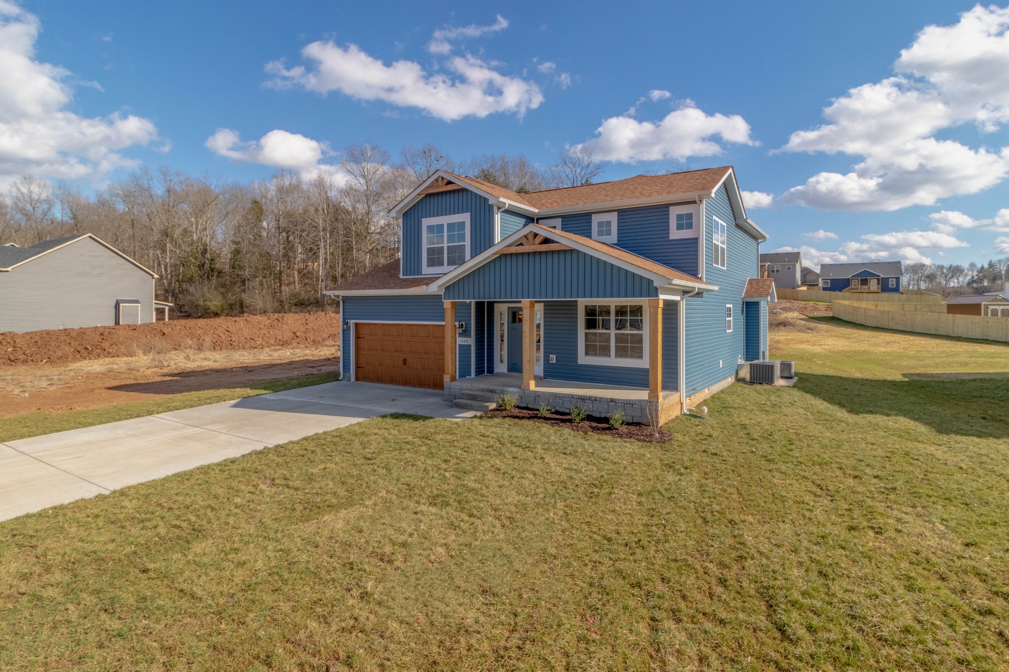 1688 Rains Road Clarksville, TN 37042 - Photo 2 of 32 a front view of a house with a yard