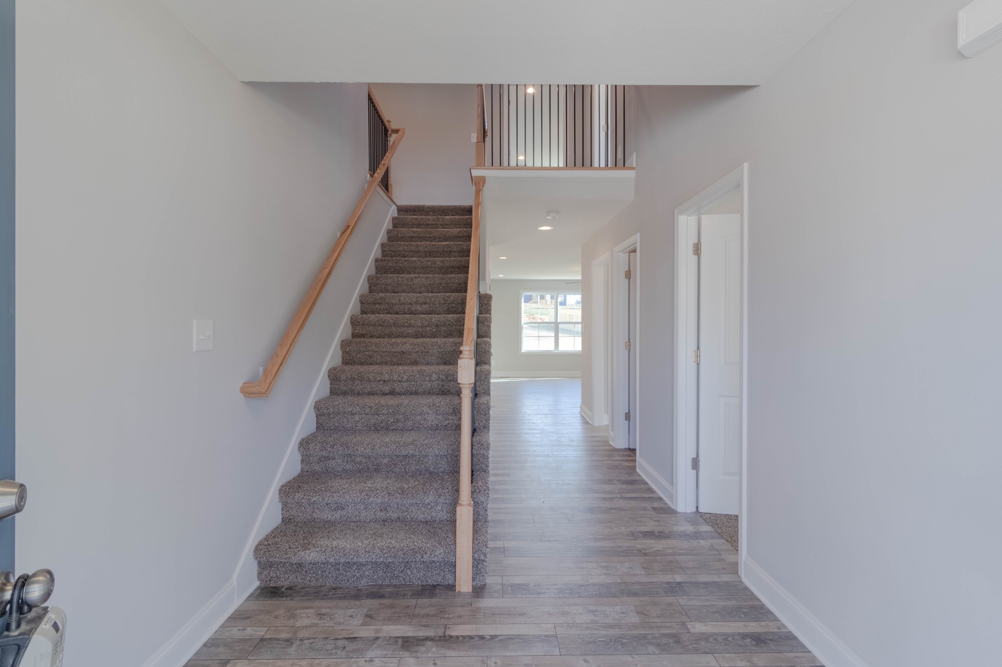 1688 Rains Road Clarksville, TN 37042 - Photo 4 of 32 a view of a hallway with wooden floor and entryway