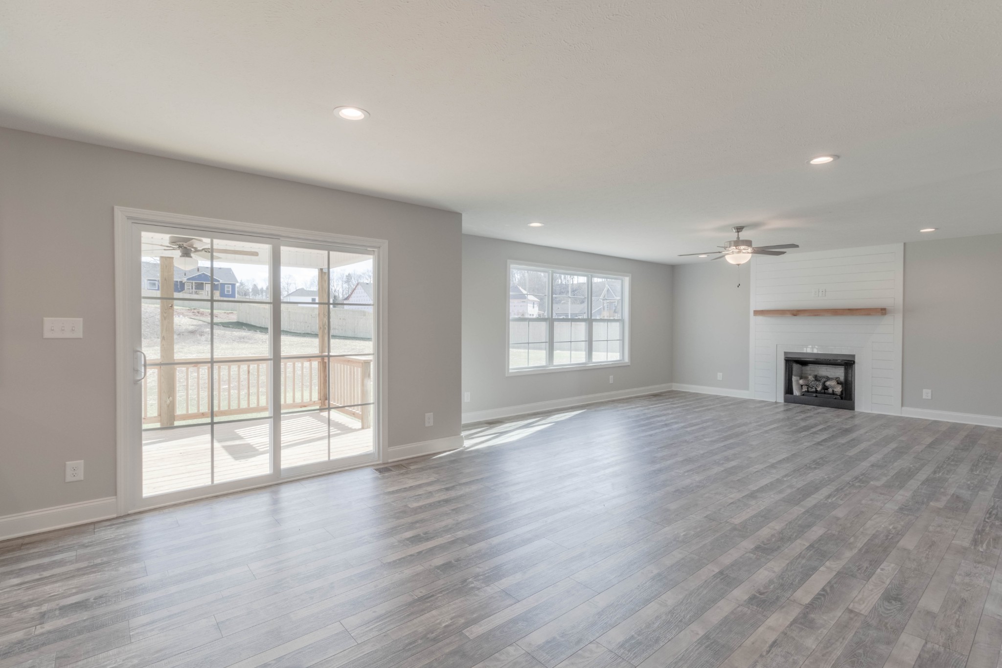 1688 Rains Road Clarksville, TN 37042 - Photo 9 of 32 wooden floor in an empty room with a window