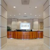 a large kitchen with stainless steel appliances a refrigerator and a washer