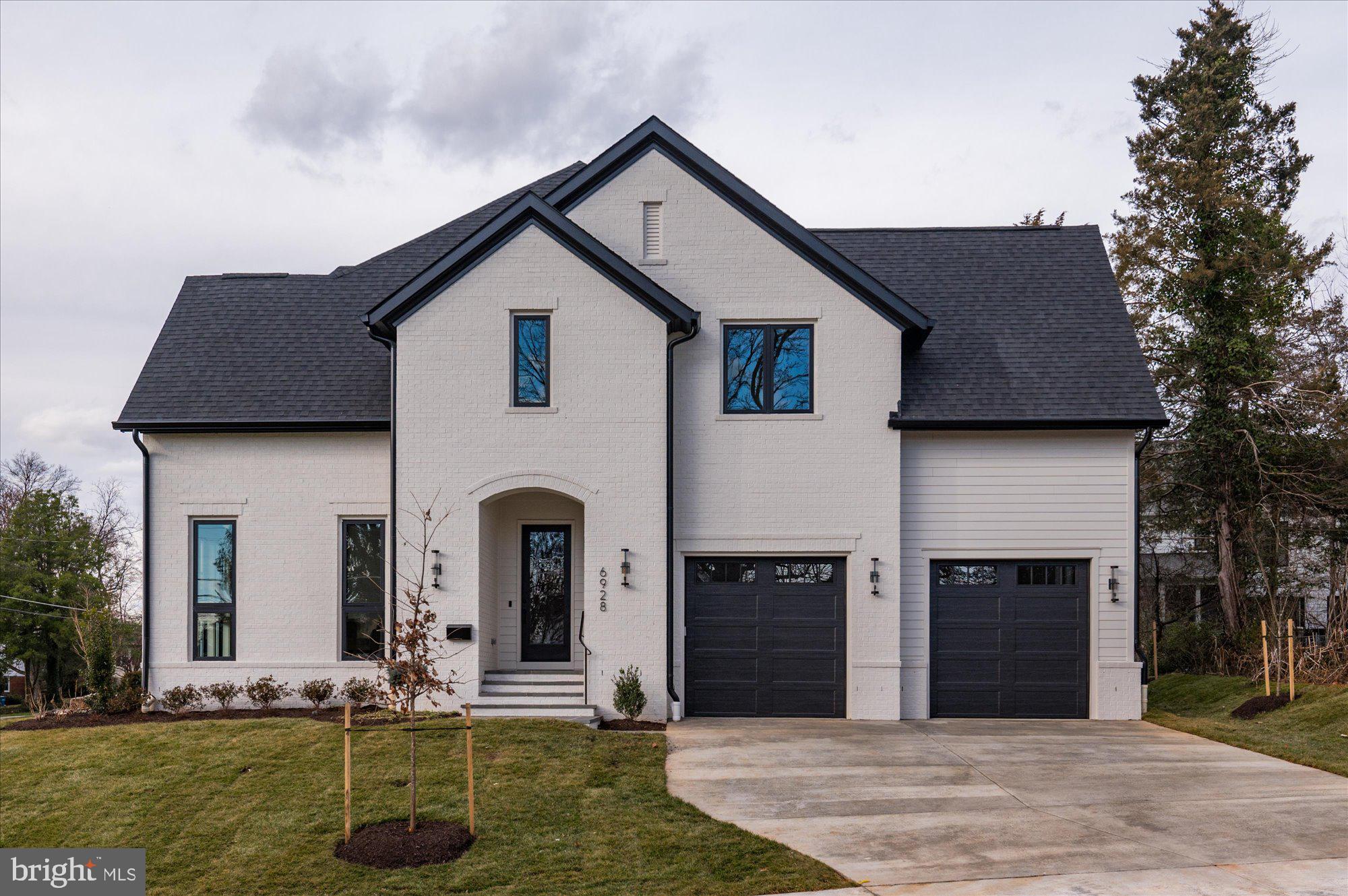 6928 Whitehall Place McLean, VA 22101 - Photo 4 of 77 a front view of a house with garden