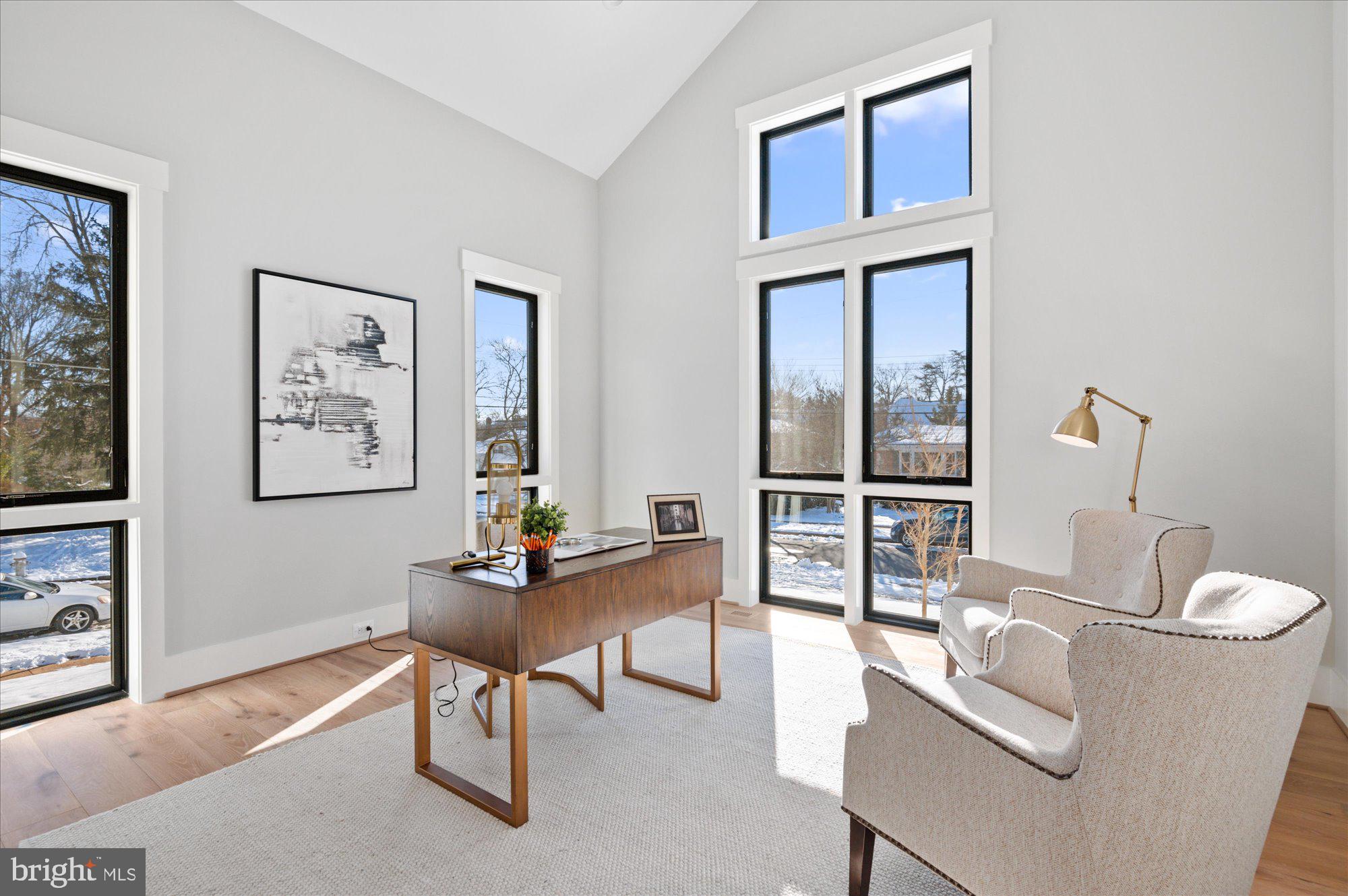 6928 Whitehall Place McLean, VA 22101 - Photo 45 of 77 a living room with furniture a table and a large window
