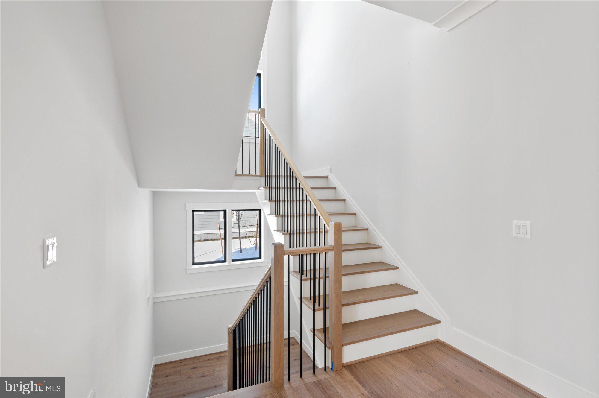 6928 Whitehall Place McLean, VA 22101 - Photo 48 of 77 a view of entryway and hall with wooden floor
